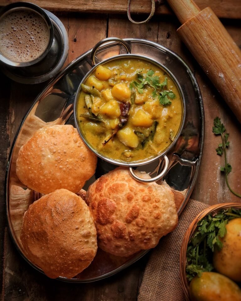 Potato curry served in a bowl, top view