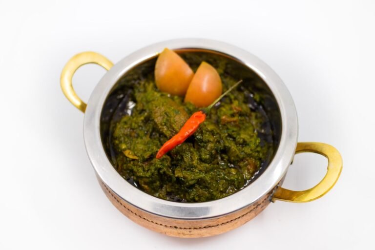 Spinach saag curry in a traditional bowl