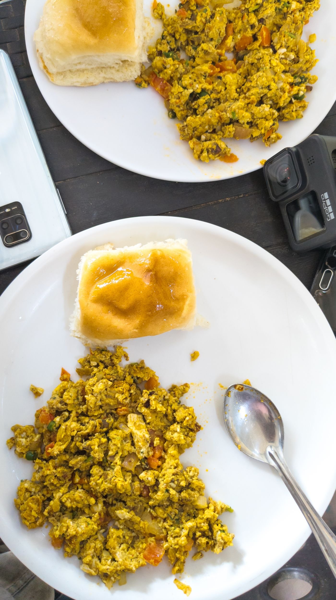 Scrambled eggs served with bread for breakfast