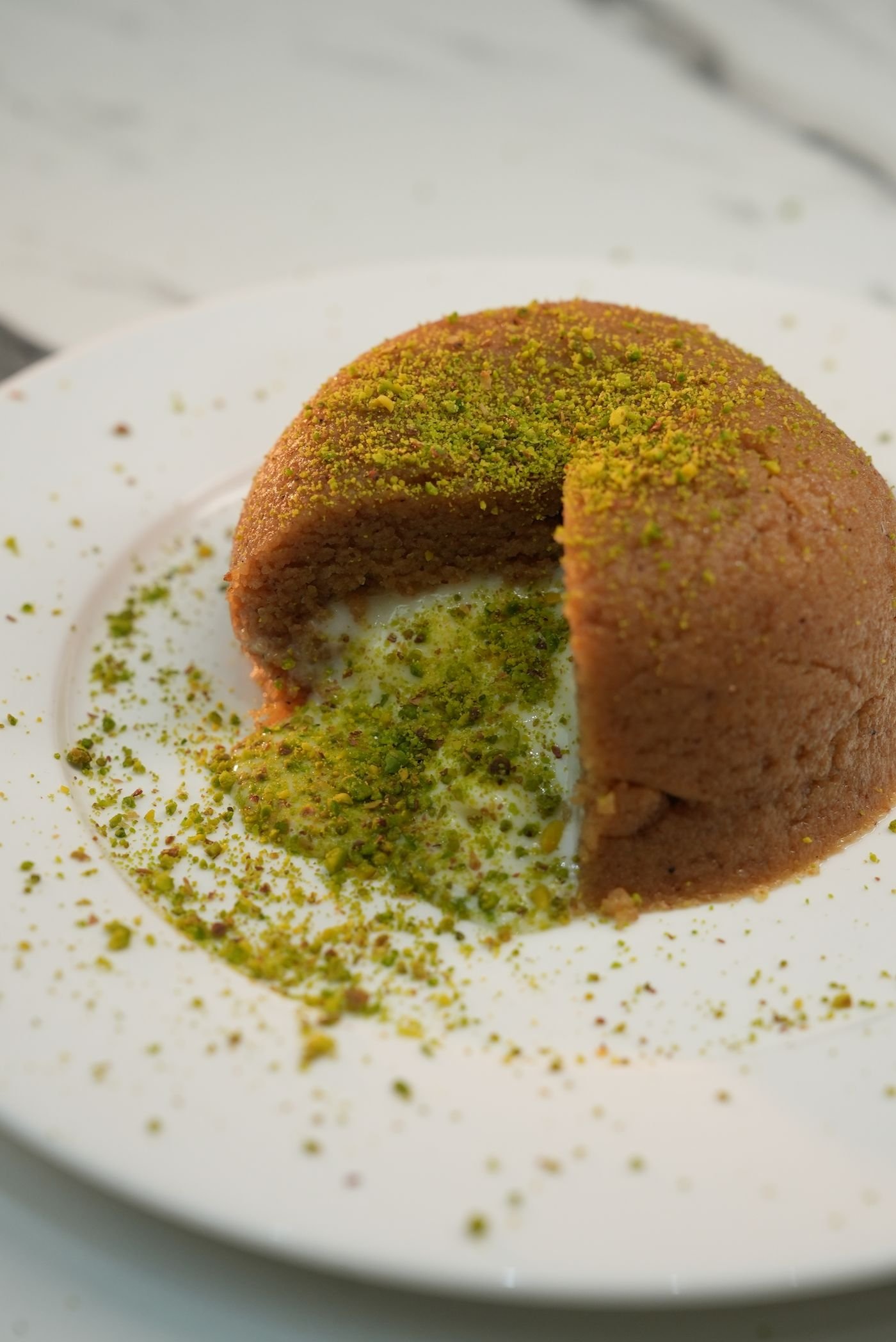 Semolina halva topped with pistachios