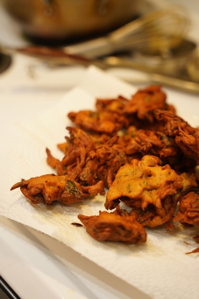 Golden brown Indian pakoras freshly fried